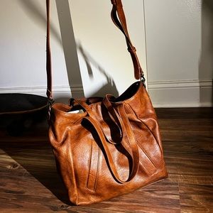 Large brown crossbody purse.